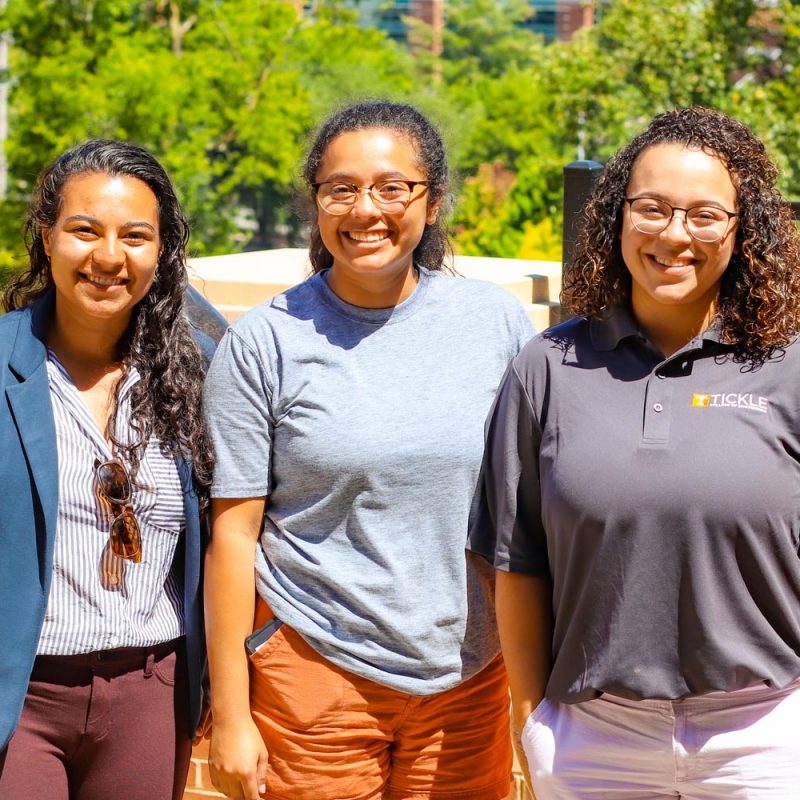 Garcia Sisters stand outside at a TCE Event