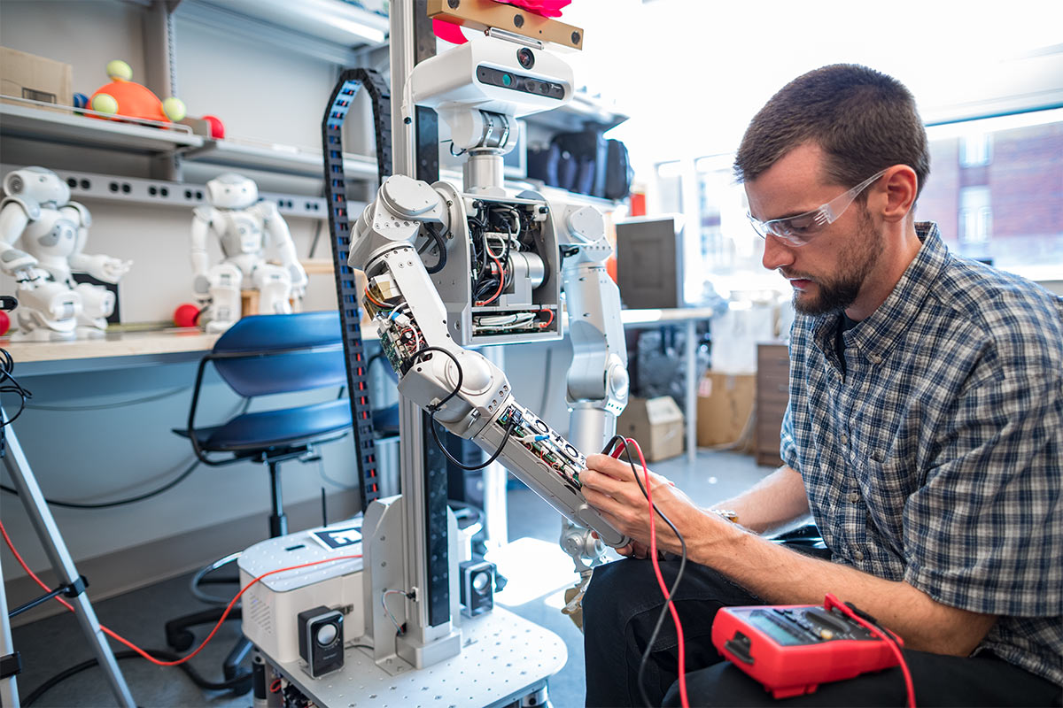 Grad Student Works in the Robotics Lab | Min H. Kao Department of ...