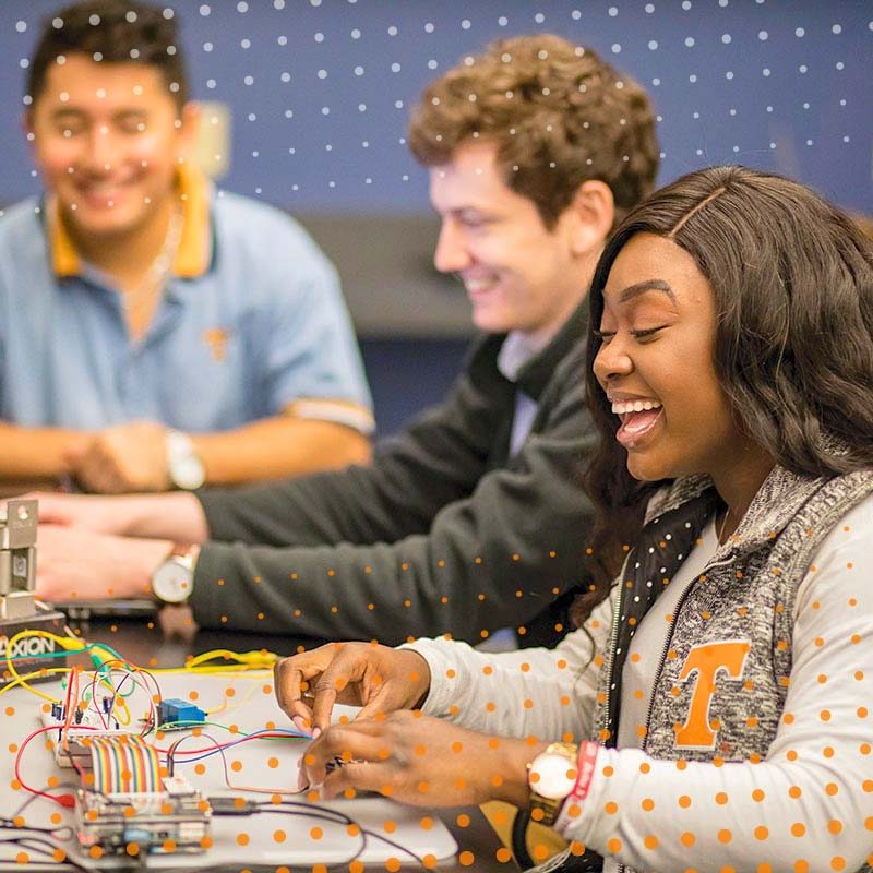 Arianna using equipment in an EECS Lab
