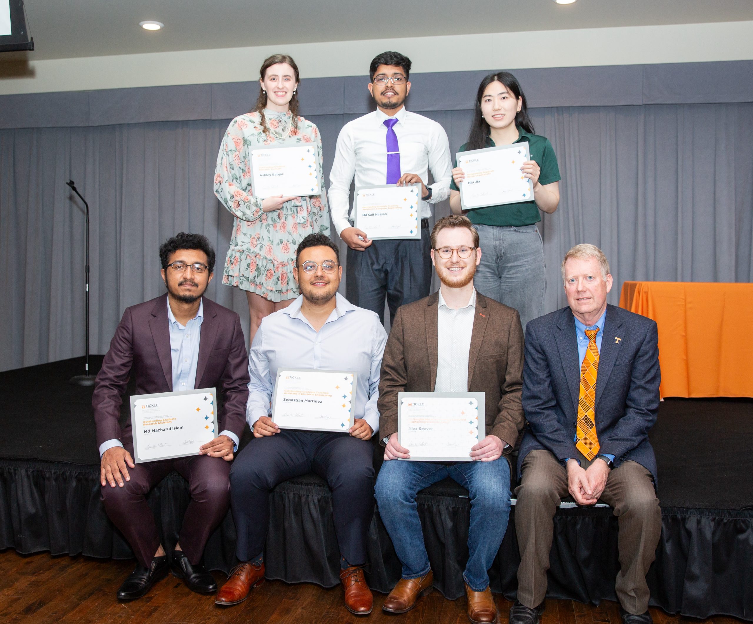 Ashley Babjac, MD Saif Hassan, Niu Jia, MD Mazharul Islam, Sebastian Martinez, Burcum Eken, and Leon Tolbert holding their awards at the Gonzalez Awards ceremony