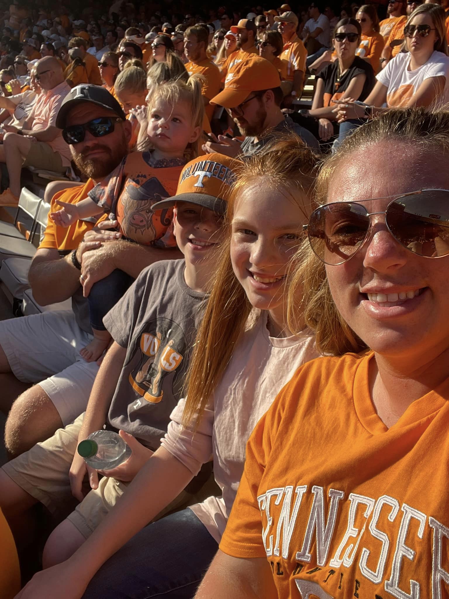 Calicura family sitting in Neyland Stadium watching a University of Tennessee football game