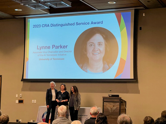 Lynne Parker accepts award at computing conference