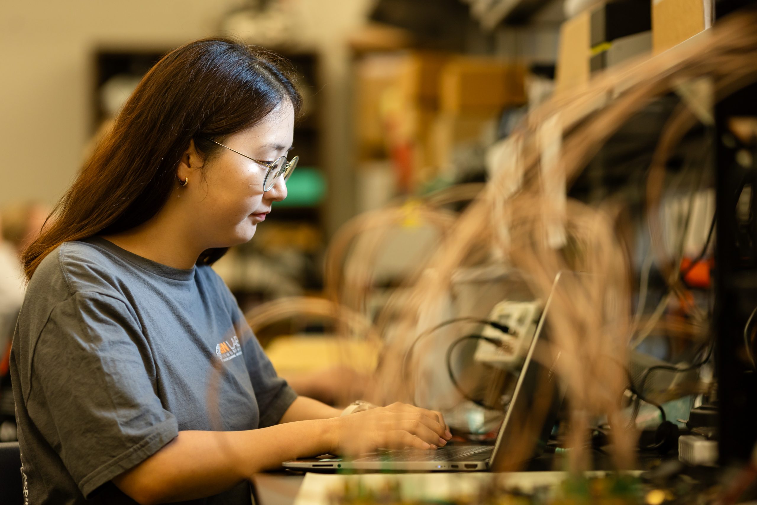 Amy An working in a computer lab