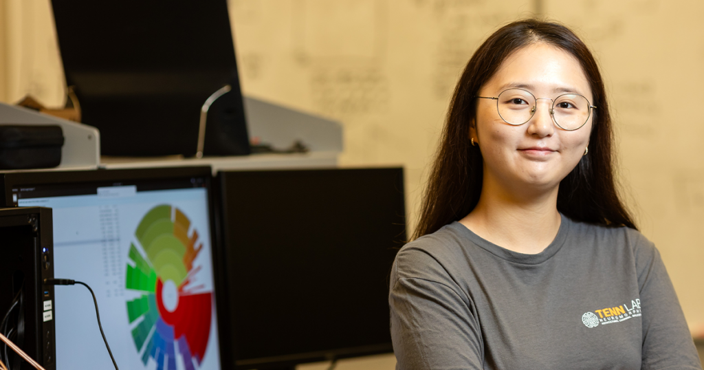 Amy An standing in a computer lab at the University of Tennessee