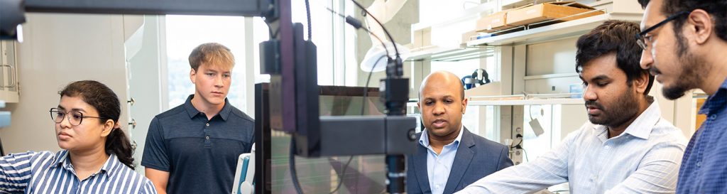 Ahmedullah Aziz and graduate students working in the NorDIC Lab