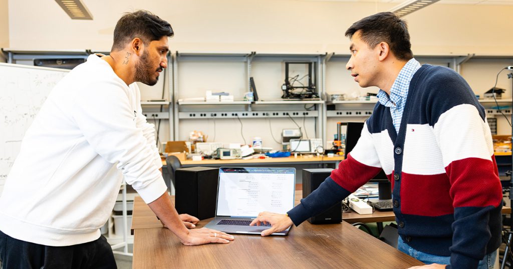 Jian Liu and Syed Irfan Ali Meerza talking about HarmonyCloak in a lab