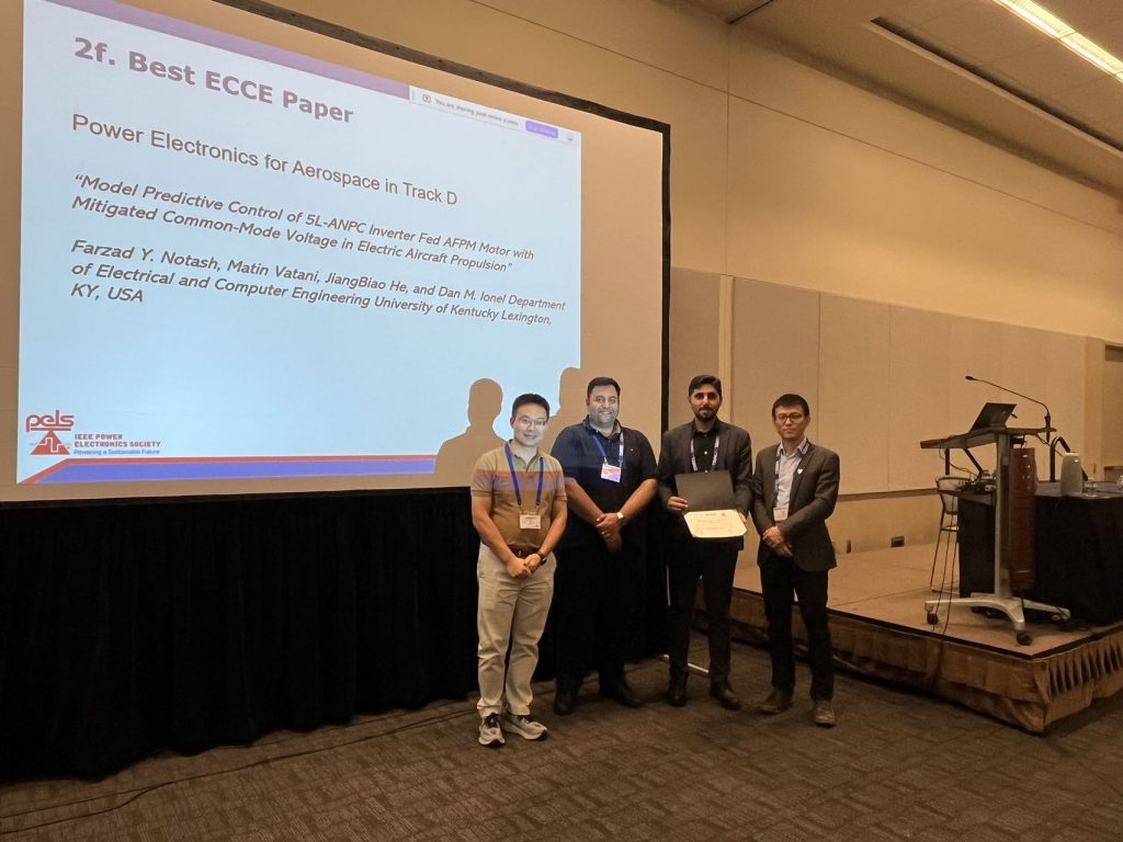 CURENT members accepting an award at the IEEE conference