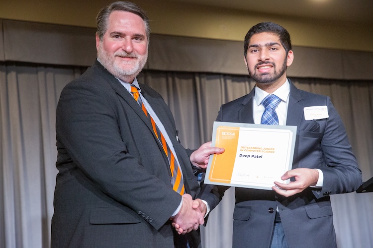 Garrett Rose and Deep Patel shaking hands
