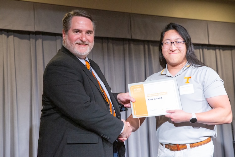Garrett Rose and Alex Zhang shaking hands