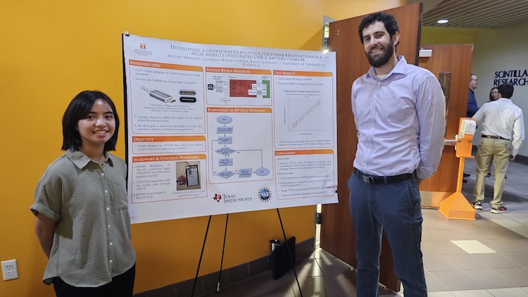 students standing with their posters at the NSF REU event
