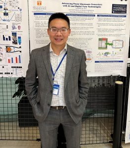 JiangBiao He standing in front of his poster