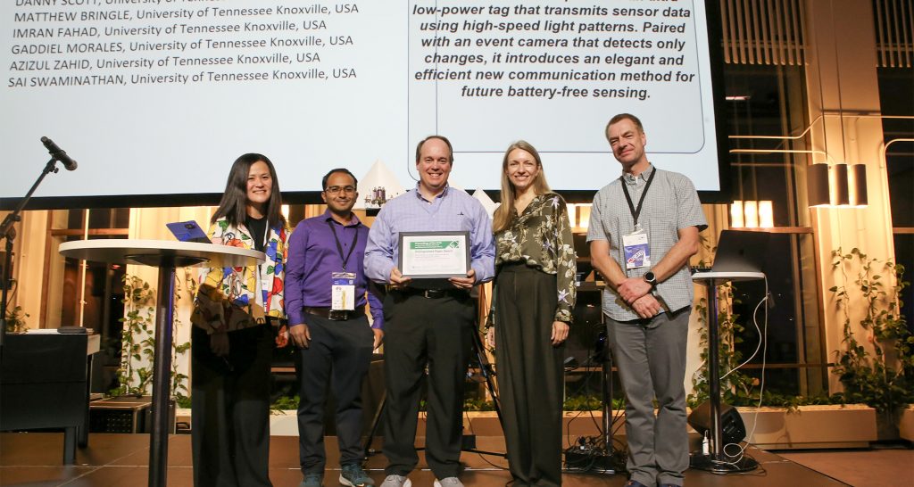 eecs phd students receive international paper award