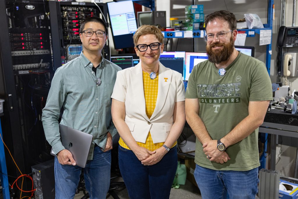 Michela Taufer stands with researchers at the Beamline Lab in Cornell