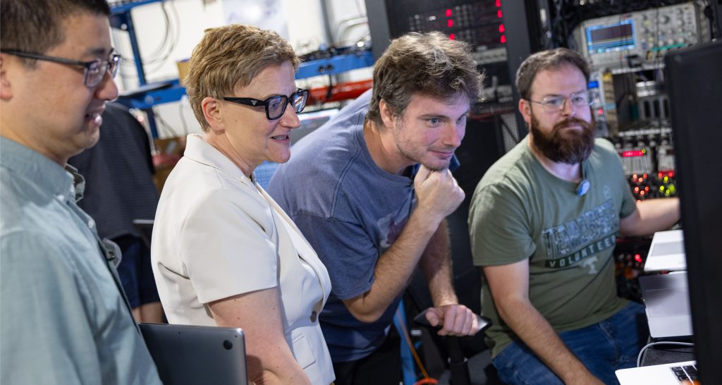 Michela Taufer and researcher from UT and Cornell University work in the Cornell CHESS Lab