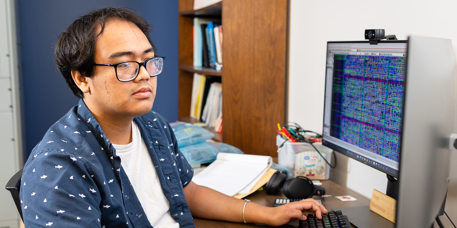 student working on a project on the computer
